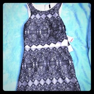 Black and cream colored dress with lace